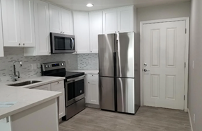 Phoenix apartment for rent - a kitchen with stainless steel appliances and white cabinets
