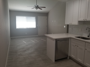 Phoenix apartment for rent - an empty kitchen with a sink and a ceiling fan