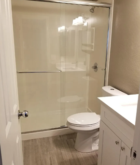 Phoenix apartment for rent - a white bathroom with a shower and a toilet