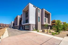 Tempe townhouse for rent - a building with a sidewalk and a street in front of it
