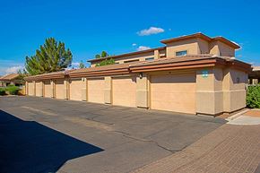 Chandler apartment for rent - a row of automated garage doors in front of a building