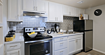Kitchen with grey subwya tile 