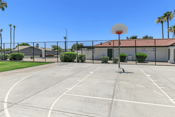 Outdoor basketball court with view of apartments