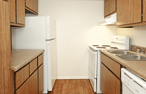 Phoenix apartment for rent - a kitchen with white appliances and wooden cabinets
