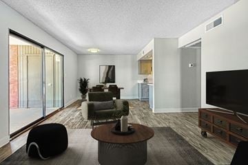 Glendale apartment for rent - A modern living room with a black bean bag chair and a wooden coffee table.
