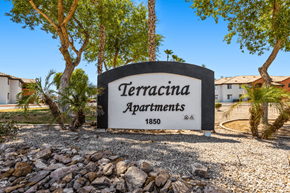Yuma apartment for rent - A sign for TerraCina Apartments is displayed in front of some trees.