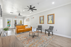 Yuma apartment for rent - A living room with a yellow couch, two chairs, and a coffee table.