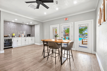 Yuma apartment for rent - A kitchen with a dining table and chairs in the middle of the room.