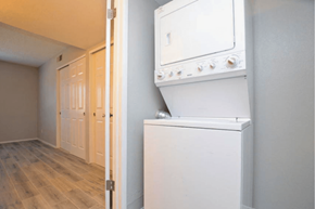 Phoenix apartment for rent - a white washer and dryer in a room with a wooden floor