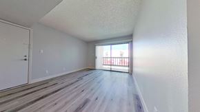 Phoenix apartment for rent - A room with a white door and a window with a view of a building outside.