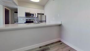Phoenix apartment for rent - A kitchen with white cabinets and appliances.