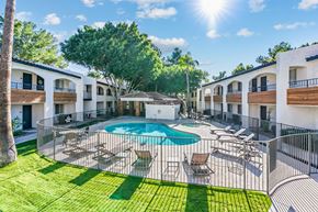 Phoenix apartment for rent - A sunny day at a resort with a pool and lounge chairs at Tides on East Cactus Apartments, Arizona, 85032