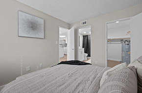 Phoenix apartment for rent - A bedroom with a large bed and a mirror on the wall  at Tides on McDowell, Phoenix, AZ