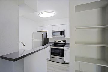 Phoenix apartment for rent - a kitchen with white cabinets and stainless steel appliances