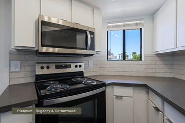 Scottsdale townhouse for rent - A modern kitchen with a stainless steel oven and microwave.