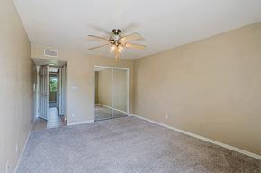 Scottsdale townhouse for rent - A room with a ceiling fan and carpeted floor.