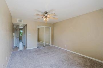 Scottsdale townhouse for rent - A room with a ceiling fan and carpeted floor.