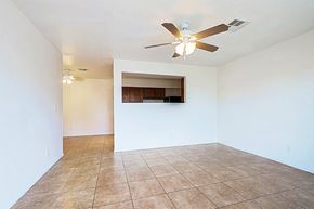 Goodyear apartment for rent - Empty room with a ceiling fan and tiled floor.