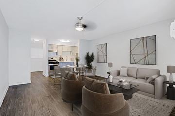 Mesa apartment for rent - A living room with a brown chair and a grey couch.