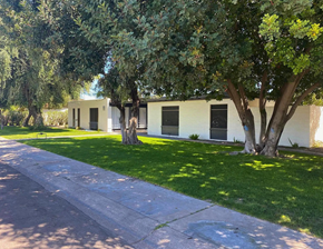 Scottsdale apartment for rent - A white building with a tree in front of it.
