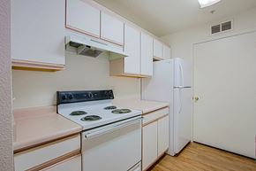 Yuma apartment for rent - A kitchen with a stove and a refrigerator.