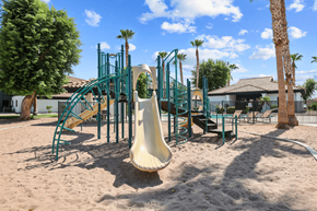 Yuma apartment for rent - a playground with a slide in the middle of the sand
