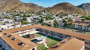 Phoenix apartment for rent - A large building with a baseball field in the middle of it.
