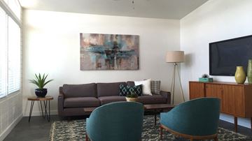 Phoenix apartment for rent - a living room with a couch and chairs and a television