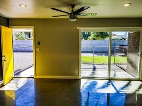 Phoenix apartment for rent - a living room with a sliding glass door and a view of a yard