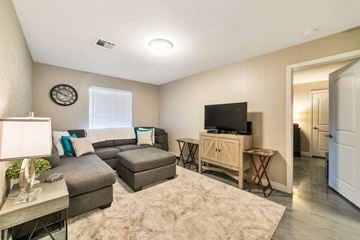 Phoenix apartment for rent - a living room with a couch and a tv