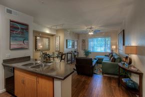 Phoenix apartment for rent - a kitchen and living room with a sink and a ceiling fan