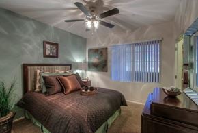 Phoenix apartment for rent - a bedroom with a bed and a ceiling fan