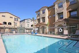 Tempe apartment for rent - a large swimming pool in front of some apartment buildings
