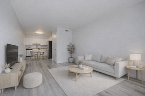 Phoenix apartment for rent - A modern living room with a white couch, wooden coffee table, and a television.