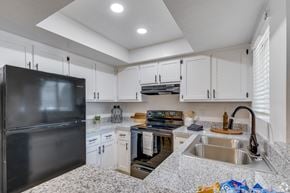 Glendale apartment for rent - an updated kitchen with granite counter tops and white cabinets