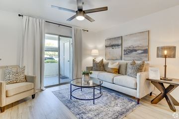 Glendale apartment for rent - a living room with a couch and a chair and a sliding glass door
