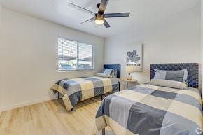Glendale apartment for rent - two beds in a bedroom with a ceiling fan and a window