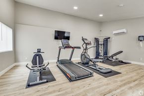 Scottsdale apartment for rent - A spacious home gym with a variety of exercise equipment.