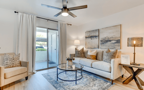 Glendale apartment for rent - a living room with a ceiling fan and a sliding glass door