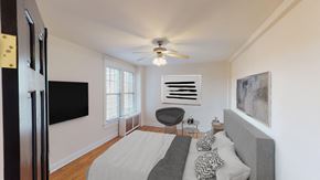 Washington apartment for rent - bedroom with bed, desk, large windows and tv at the cortland apartments in washington dc