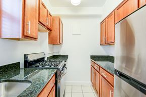 Washington apartment for rent - Renovated kitchen with stainless steel appliances and oak cabinetry at 2800 woodley road apartments in woodley park washington dc