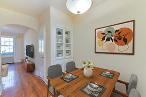 Washington apartment for rent - a dining room with a wooden table and chairs