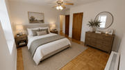 Washington apartment for rent - A bedroom with a large bed, a wooden dresser, and a ceiling fan.