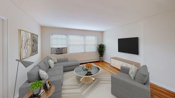 Washington apartment for rent - a living room with couches and a table and a television