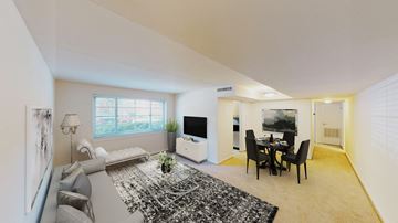 Bethesda apartment for rent - a living room and dining room with a couch and a table