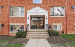 Bethesda apartment for rent - exterior entrance of brick apartments at cambridge square apartments in bethesda md
