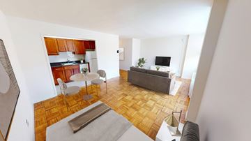 Washington apartment for rent - A living room with a grey couch and a white table.