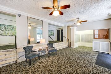 Washington apartment for rent - a living room with two chairs and a ceiling fan