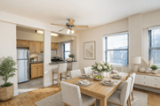 Washington apartment for rent - A dining room with a table set for a meal.