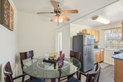 Washington apartment for rent - A dining room with a glass table and chairs.